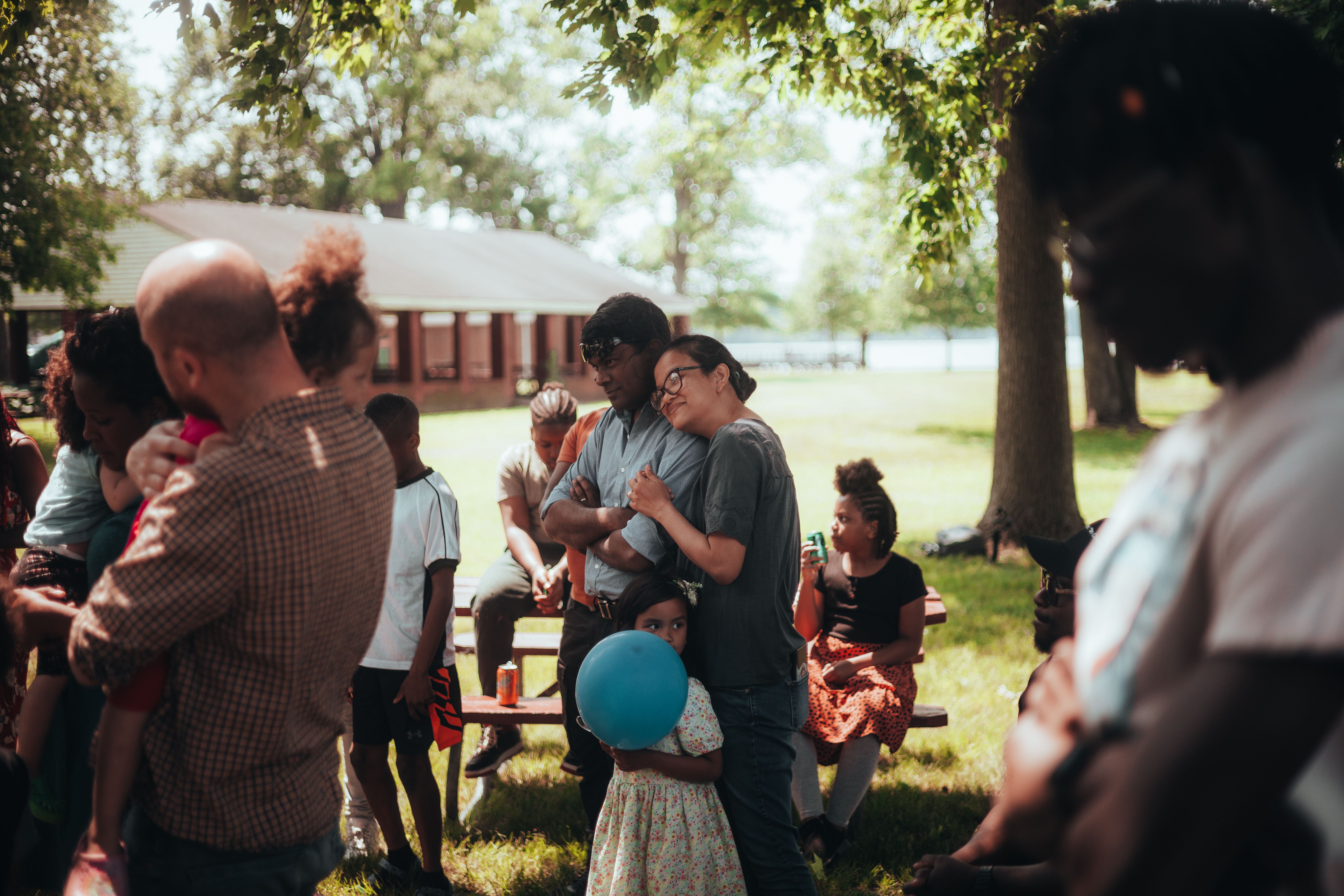 A community gathering in the service area — wide shot